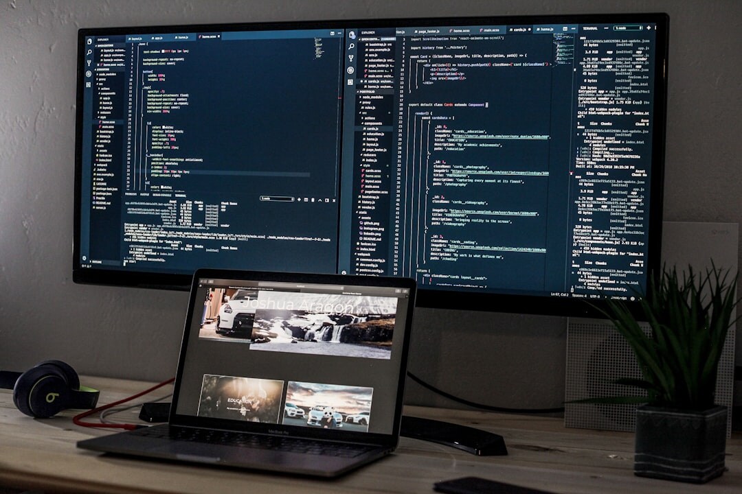 Web development workstation with multiple monitors showing HTML and CSS code