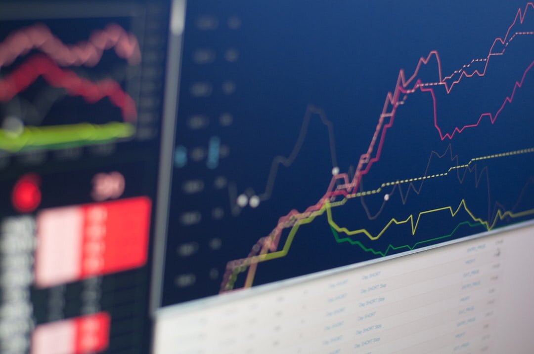 Data analytics dashboard on screen with charts and graphs