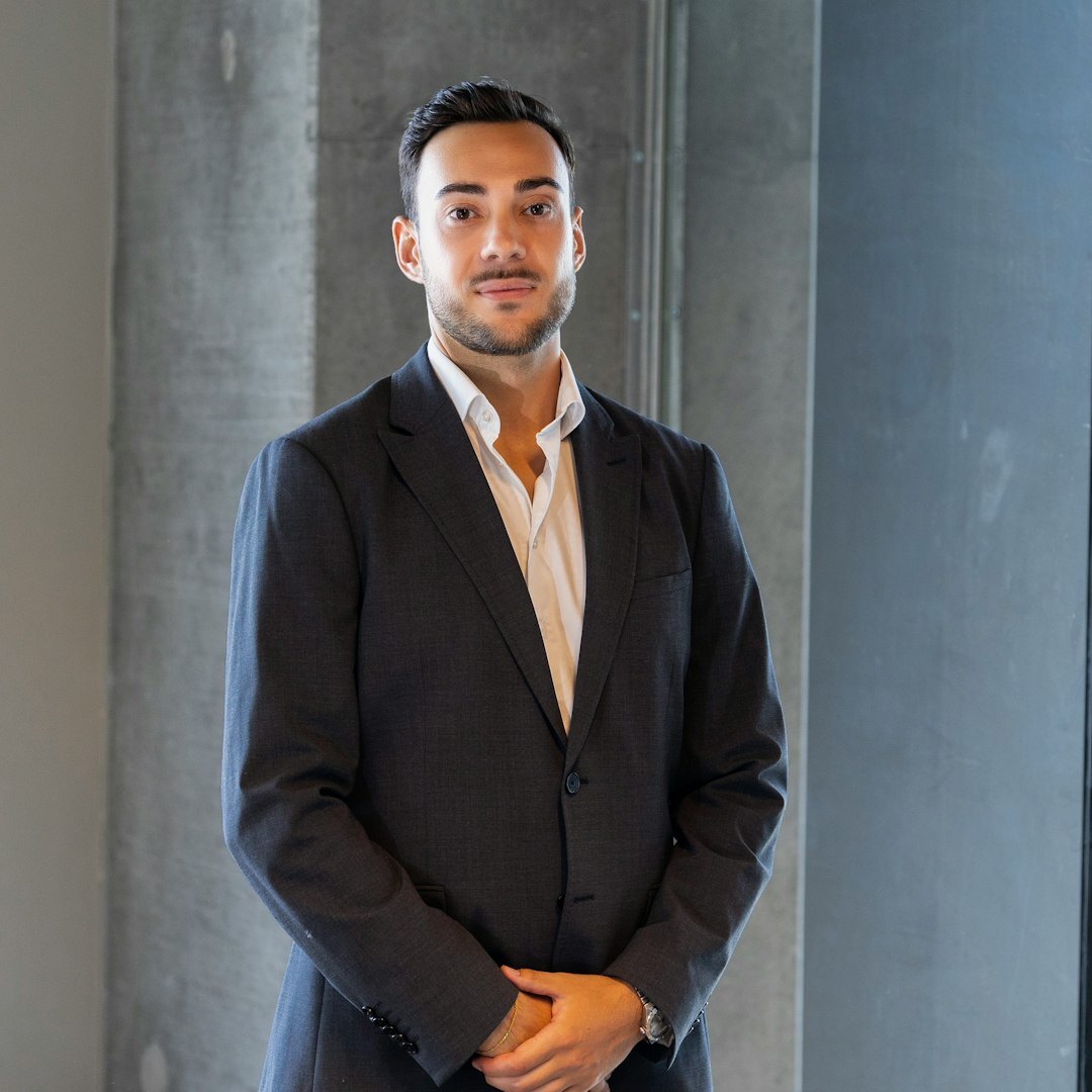 Professional man with short beard in business casual attire